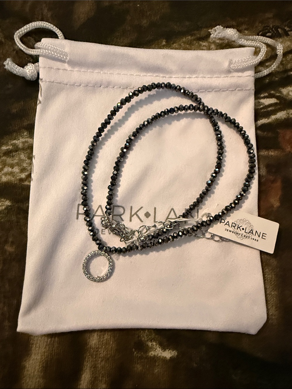 PARK LANE Hematite-Tone Faceted Bead Necklace with Crystal Circle Charm